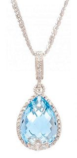 * A 14 Karat White Gold, Blue Topaz and Diamond Pendant/Necklace, 7.05 dwts.