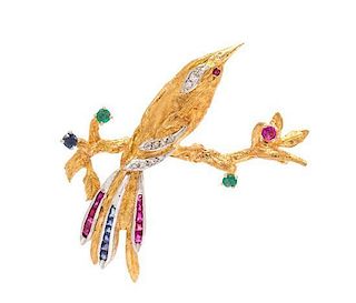 * An 18 Karat Yellow Gold, Platinum, Diamond, Ruby, Sapphire and Emerald Bird Brooch, 6.00 dwts.