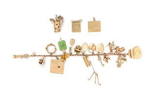A 14 Karat Yellow Gold Bracelet with 18 Attached and Unattached Charms, 55.20 dwts.