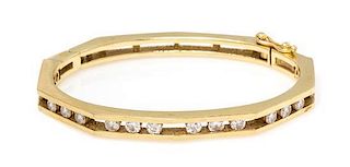 * An 18 Karat Yellow Gold and Diamond Bangle Bracelet, 21.90 dwts.