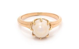 * A 14 Karat Rose Gold and Pearl Solitaire Ring, 2.00 dwts.