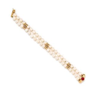 A 14 Karat Yellow Gold, Cultured Pearl and Coral Double Strand Bracelet,