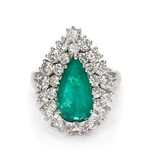 * A 14 Karat White Gold, Emerald and Diamond Ring, 5.40 dwts.