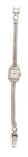 * A Retro 14 Karat White Gold and Diamond Wristwatch, Croton, 13.40 dwts.