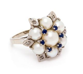 A 14 Karat White Gold, Cultured Pearl, Sapphire and Diamond Ring, 6.37 dwts.