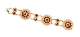 * A 14 Karat Yellow Gold and Garnet Cluster Bracelet, 25.20 dwts.