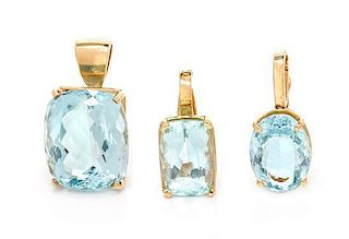 * A Collection of Yellow Gold and Aquamarine Pendants, 15.15 dwts.