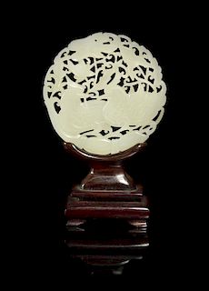 A Carved White Jade Medallion, Width 2 5/8 inches.
