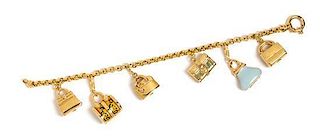 * A 14 Karat Yellow Gold Bracelet with Six Attached Gold Purse Motif Charms, 12.60 dwts.