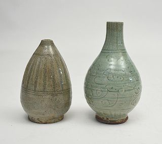 Two early Chinese celadon glazed and carved design vases