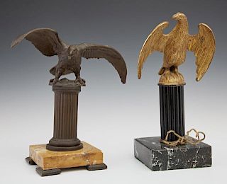 Two Bronze Eagle Figures, 19th c., one a watch holder of patinated bronze, on a column on an ocher marble base with bronze fe