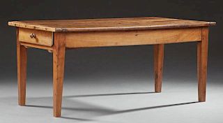 French Provincial Fruitwood Farmhouse Table, 19th c., the rectangular plank top over a wide skirt with single end frieze draw