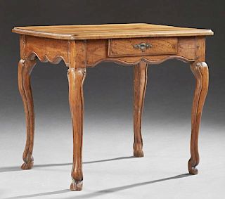 Louis XV Style Carved Walnut Side Table, 19th c., the stepped ogee edge rounded corner top over serpentine skirt with a friez
