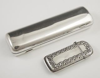 Two Sterling Smoking Items, early 20th c., consisting of a match safe with repousse decoration and a small two finger pocket 