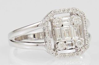Lady's 14K White Gold Dinner Ring, with six baguette diamonds, within four round diamond mounted corners and a split sided ba