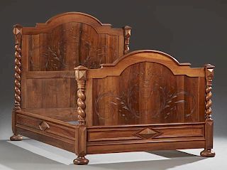 French Henri II Style Carved Walnut Bed, early 20th c., the arched headboard with an incised back within rope twist supports,