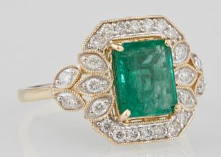 Lady's 14K Yellow Gold Dinner Ring, with a 2.16 carat rectangular emerald atop an octagonal frame of round diamonds, flanked 