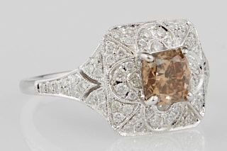 Lady's 18K White Gold Dinner Ring, with a 1.04 carat cushion cut fancy brown diamond atop a square frame mounted with round d