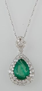 18K White Gold Pendant, with a 2.48 carat pear shaped emerald atop a conforming double concentric graduated border of round d