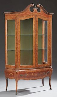 French Louis XV Style Marquetry Inlaid Walnut Bombe Vitrine, early 20th c., the broken arch scrolled crown over double glazed