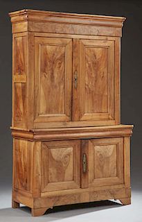 Louis Philippe Style Carved Walnut Buffet a Deux Corps, 20th c., the rounded edge ogee crown over two paneled doors, on a bas