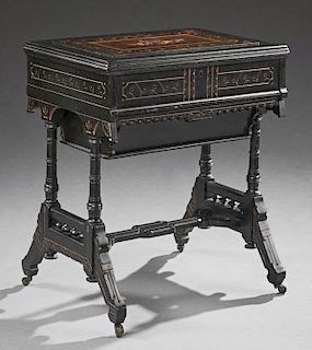 American Aesthetic Ebonized Inlaid Gilt Incised Desk, c. 1880, the lifting lid with an interior mirror over a cantilevered po