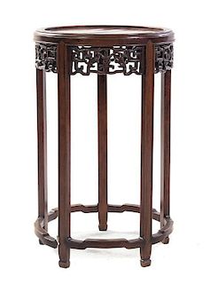 A Chinese Carved Rosewood Side Table, Height 26 x diameter 16 1/4 inches.