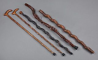 Group of Five Carved Wood Folk Art Canes, one dated 1884, two with alligator L-shaped handles, one with a snake circling the 