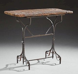 Rustic Aged Wood and Iron Bistro Table, early 20th c., the rough hewn rectangular top on an iron trestle base, H.- 30 1/8 in.