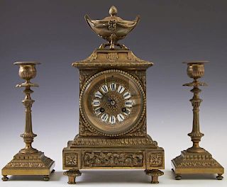 Diminutive French Louis XVI Style Gilt Bronze Three Piece Clock Set, 19th c., the time and strike clock with a covered tureen