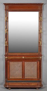 French Carved Mahogany Hall Stand, 19th c., the stepped crown over a wide beveled mirror flanked by reeded stiles with six br