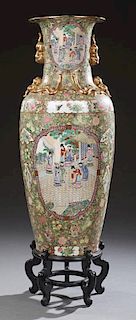 Large Oriental Famille Rose Baluster Palace Vase, 20th c., the sides with gilt Foo dog handles above panel decorations of fig