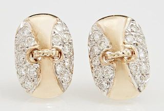 Pair of 14K Yellow Gold Pierced Earrings, of oval form, the sides and pierced center mounted with round diamonds, with omega 