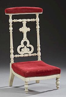 French Polychromed Beech Prie Dieu, c. 1870, the upholstered arm rest over a cross back splat, above a pierced trefoil, to a 