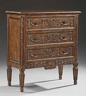 Diminutive Louis XVI Style Carved Beech Chest, 20th c., the rectangular top over three drawers with applied swag decoration, 