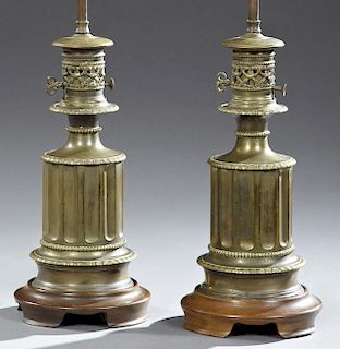 Pair of Victorian Brass Oil Lamps, late 19th c., of reeded columnar form, now electrified and mounted on custom mahogany base