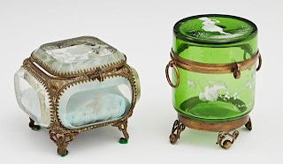 Two Glass Ring Boxes, 19th c., a green Mary Gregory style example with enameled decoration; the second of beveled glass with 