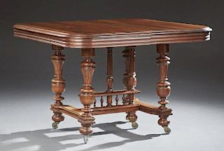 French Henri II Carved Walnut Dining Table, late 19th c., the stepped reeded edge top on turned tapered urn trestle supports,