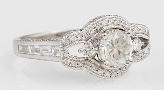 Lady's Platinum Dinner Ring, with a central .8 carat diamond within a pierced lobed border of round diamonds, the shoulders o