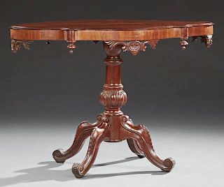 Continental Carved Mahogany Center Table, 19th c., the stepped tortoise shape top, on a tapered lobed pedestal with quadruped