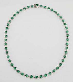 Platinum Necklace, each of the fifty links with an oval emerald atop a border of round diamond "points," total emerald weight