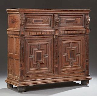 French Provincial Carved Inlaid Oak Renaissance Style Tall Sideboard, 19th c., the rounded edge crown over double cupboard do