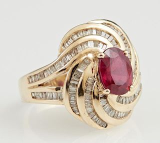 Lady's 14K Yellow Gold Dinner Ring, with an oval 2.58 carat ruby atop a swirled top mounted with numerous baguette diamonds, 