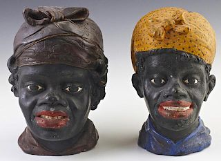 Pair of American Carved Wood Female Blackamoor Heads, late 19th c., with polychromed decoration, H.- 8 1/8 in., W.- 5 1/4 in.