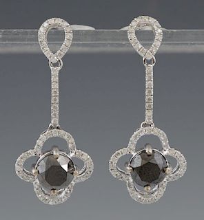 Pair of 14K White Gold Pierced Pendant Earrings, with diamond mounted pierced studs to a diamond mounted bar, suspending a di