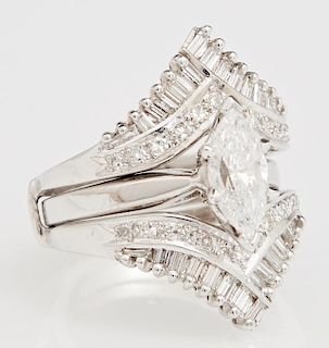 Lady's 14K White Gold Dinner Ring, with a central 1.17 carats marquise diamond flanked by a chevron above and below, mounted 