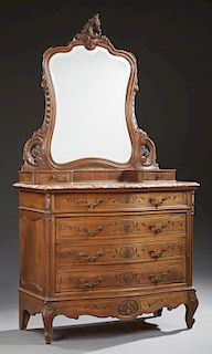 Large French Louis XV Style Carved Marble Top Bowfront Commode, early 20th c., the ogee edge highly figured rouge marble over