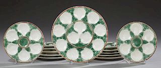 French Thirteen Piece Ceramic Oyster Set, late 19th c., consisting of twelve plates and a platter, H.- 1 in., Dia.- 13 in.