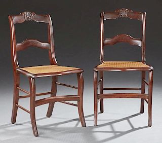Pair of American Carved Mahogany Side Chairs, late 19th c., the arched leaf and scroll carved crest rail over an arched horiz