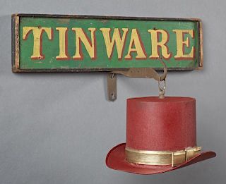American Hand Painted Wooden Tin Ware Trade Sign, 19th c., in an ebonized frame, together with a pendant sheet iron top hat a